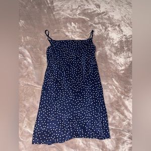 Dark blue dress with white polka dots.